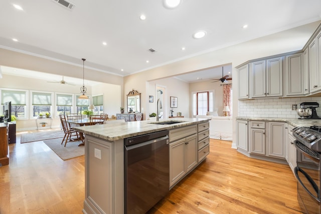 kitchen with dishwashing machine, black range with gas cooktop, visible vents, and gray cabinetry