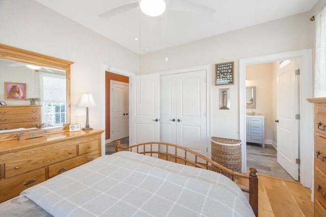 bedroom featuring light wood-style flooring, baseboards, a closet, and ceiling fan