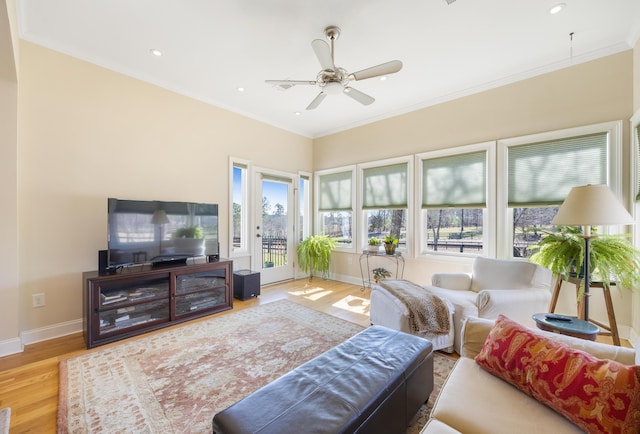 living room featuring crown molding, baseboards, recessed lighting, wood finished floors, and a ceiling fan