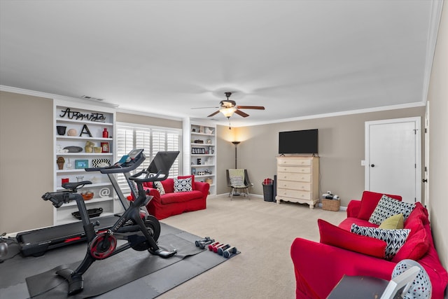 exercise room featuring crown molding, light carpet, built in features, and ceiling fan