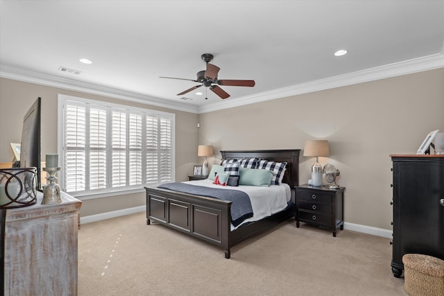 bedroom with ornamental molding, light colored carpet, and ceiling fan