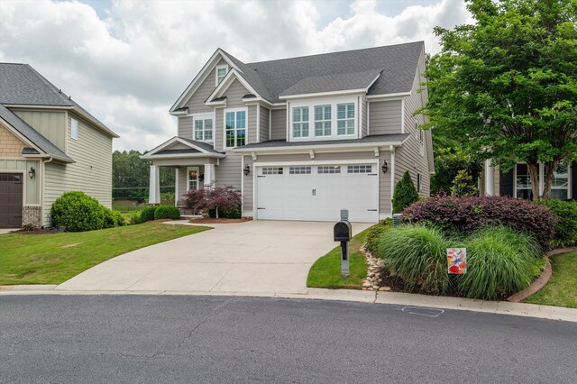 884 Willow Lk, Evans, GA 30809 - craftsman-style house with a garage, a shingled roof, a front yard, and concrete driveway
