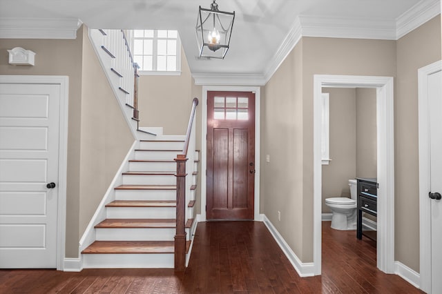 884 Willow Lk, Evans, GA 30809 - foyer entrance with crown molding, a notable chandelier, stairway, and dark wood-type flooring
