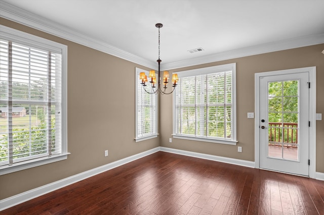 884 Willow Lk, Evans, GA 30809 - unfurnished dining area featuring an inviting chandelier, dark wood-style flooring, a healthy amount of sunlight, and baseboards
