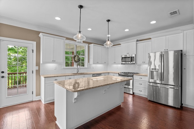 884 Willow Lk, Evans, GA 30809 - kitchen featuring white cabinets, a sink, appliances with stainless steel finishes, a center island, and dark wood-type flooring