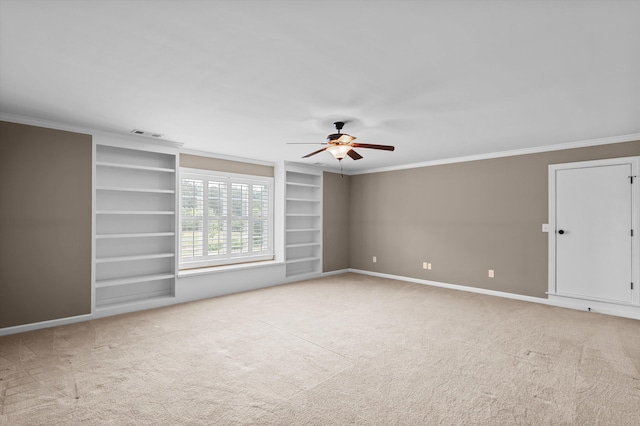 884 Willow Lk, Evans, GA 30809 - empty room featuring built in features, carpet, baseboards, a ceiling fan, and crown molding