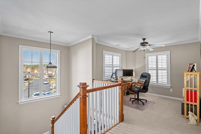 carpeted office space featuring crown molding and ceiling fan with notable chandelier