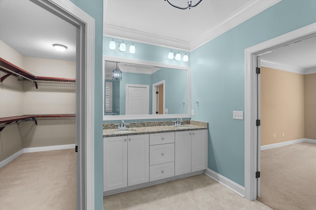884 Willow Lk, Evans, GA 30809 - full bath featuring baseboards, double vanity, crown molding, and a sink