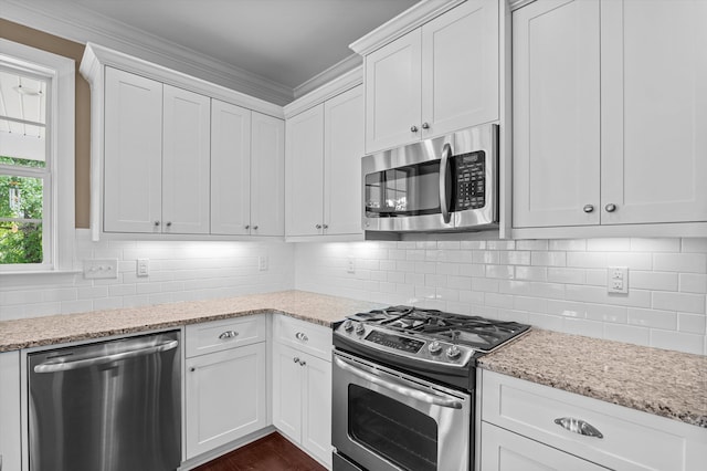 884 Willow Lk, Evans, GA 30809 - kitchen with white cabinets, appliances with stainless steel finishes, and light stone counters
