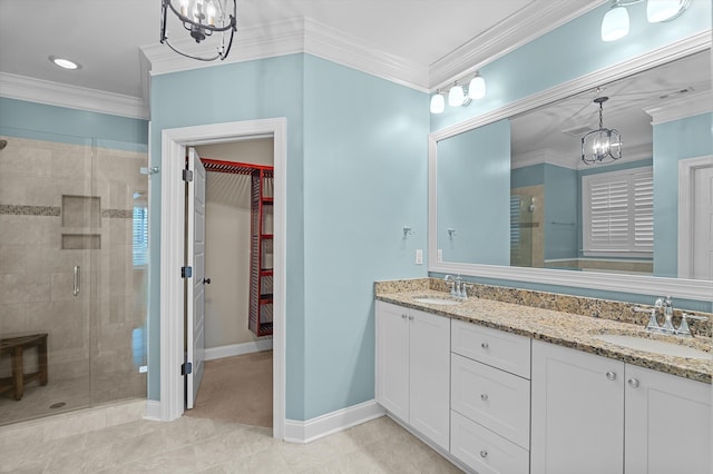 884 Willow Lk, Evans, GA 30809 - full bath featuring an inviting chandelier, a shower stall, double vanity, and a sink