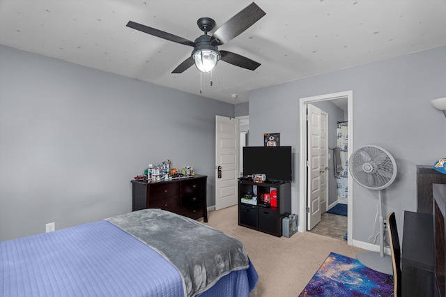 bedroom featuring a ceiling fan, baseboards, and light carpet