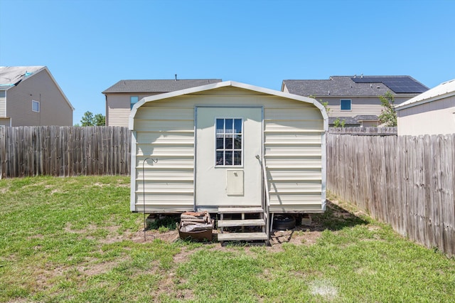 view of shed with a fenced backyard