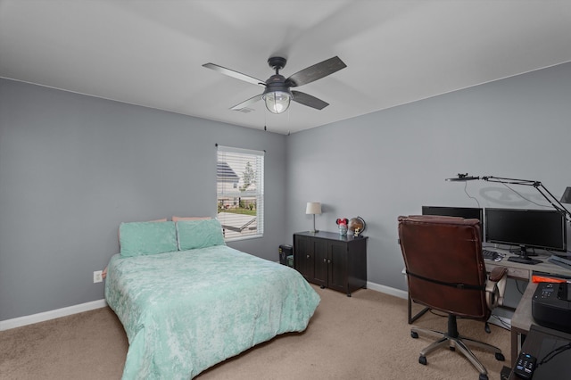 carpeted bedroom with baseboards and ceiling fan