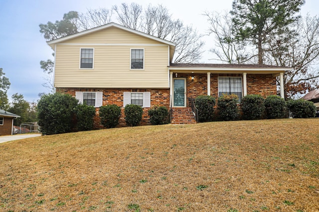 tri-level home with a front lawn