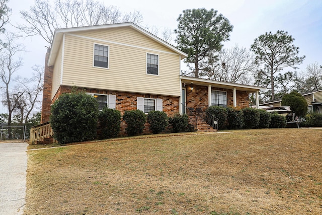 tri-level home featuring a front yard