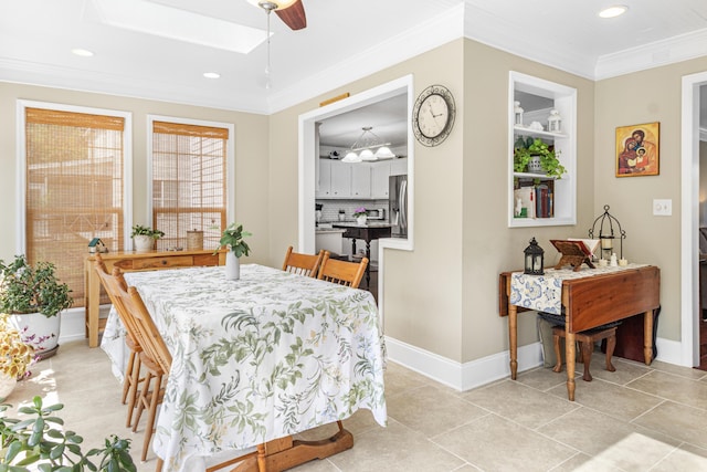4161 Eagle Nest Dr, Evans, GA 30809 - dining area with recessed lighting, baseboards, ornamental molding, a skylight, and light tile patterned floors