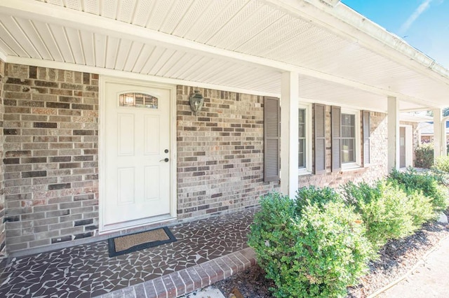 property entrance featuring a porch