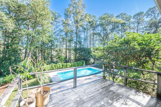 view of pool with a wooden deck