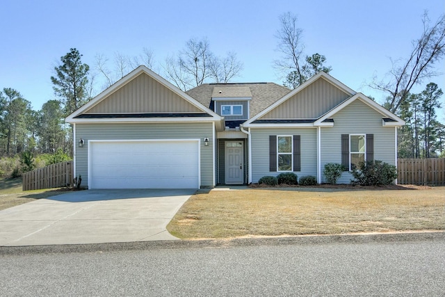 view of front of home featuring board and batten siding, fence, concrete driveway, roof with shingles, and a garage