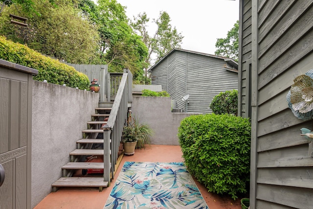 view of patio featuring stairway