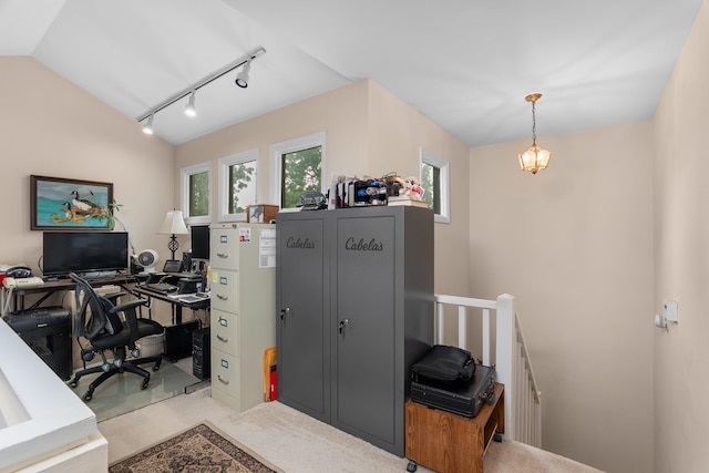 office with lofted ceiling, track lighting, a wealth of natural light, and carpet