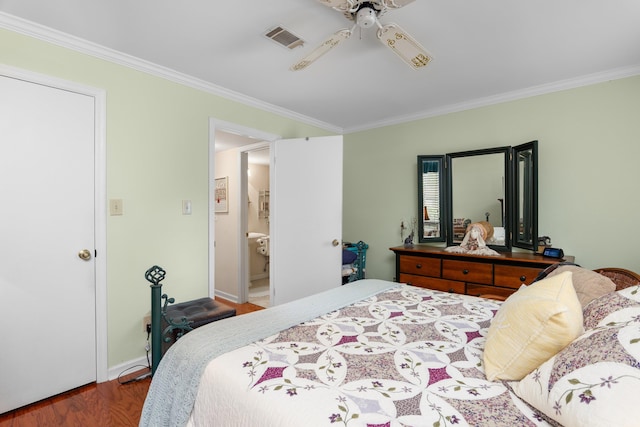 bedroom featuring visible vents, ceiling fan, baseboards, ornamental molding, and wood finished floors