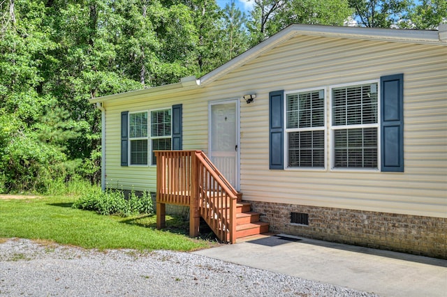 1711 Carolyn Lake Cir, Thomson, GA 30824 - view of front of home with crawl space and a patio