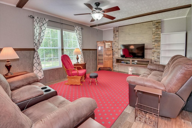 1711 Carolyn Lake Cir, Thomson, GA 30824 - living area with wood finished floors, ceiling fan, wainscoting, a textured ceiling, and built in shelves