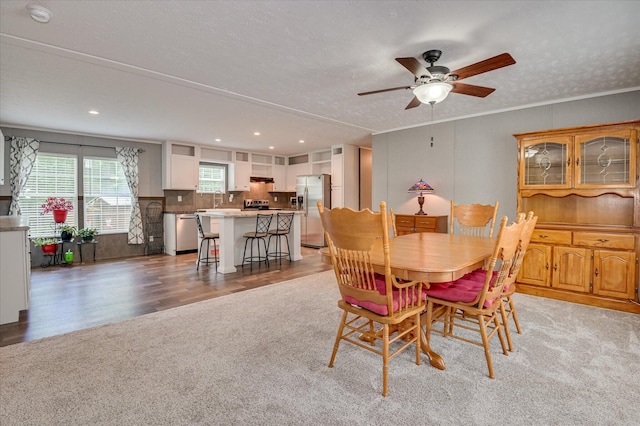 1711 Carolyn Lake Cir, Thomson, GA 30824 - dining area featuring light colored carpet, a ceiling fan, recessed lighting, a textured ceiling, and light wood-style flooring