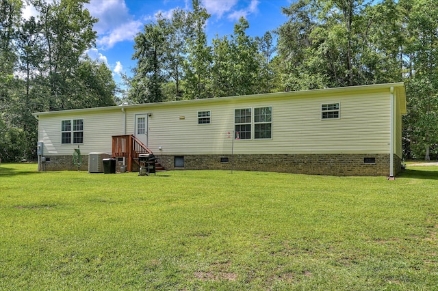 1711 Carolyn Lake Cir, Thomson, GA 30824 - back of house featuring crawl space and a yard