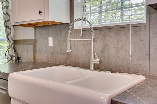 1711 Carolyn Lake Cir, Thomson, GA 30824 - kitchen view of a sink and white cabinets