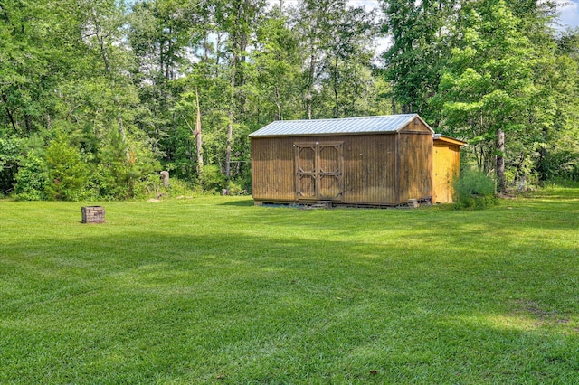 1711 Carolyn Lake Cir, Thomson, GA 30824 - view of green lawn with a storage unit
