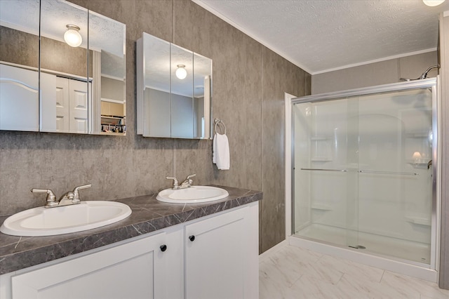 1711 Carolyn Lake Cir, Thomson, GA 30824 - bathroom featuring a stall shower, a textured ceiling, double vanity, marble finish flooring, and ornamental molding
