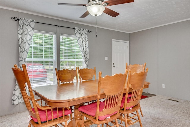 1711 Carolyn Lake Cir, Thomson, GA 30824 - dining area with ceiling fan, carpet floors, crown molding, and a textured ceiling