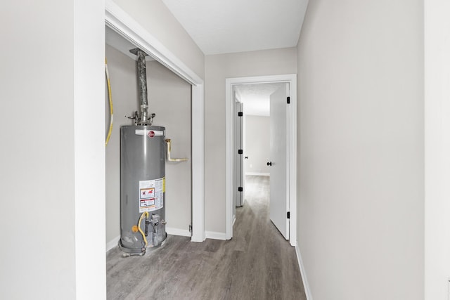 3420 Crane Ferry Rd, Augusta, GA 30907 - corridor with water heater, wood finished floors, and baseboards