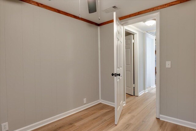 interior space with ceiling fan and light hardwood / wood-style floors