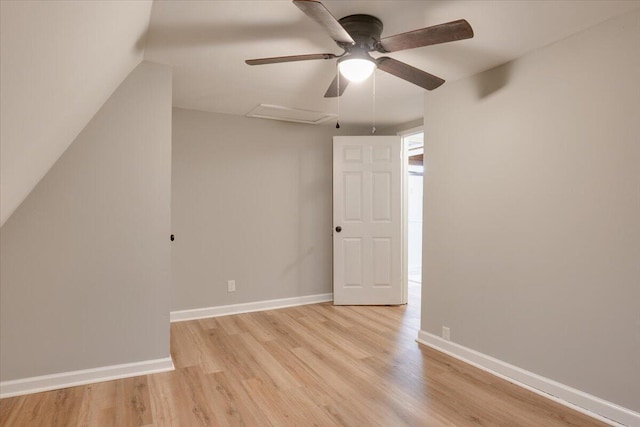 bonus room with ceiling fan, vaulted ceiling, and light wood-type flooring