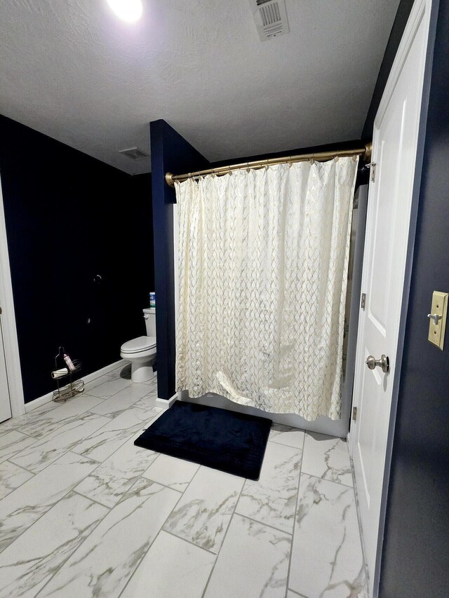 437 Arrowwood Dr, Grovetown, GA 30813 - full bath featuring baseboards, visible vents, toilet, and marble finish floor