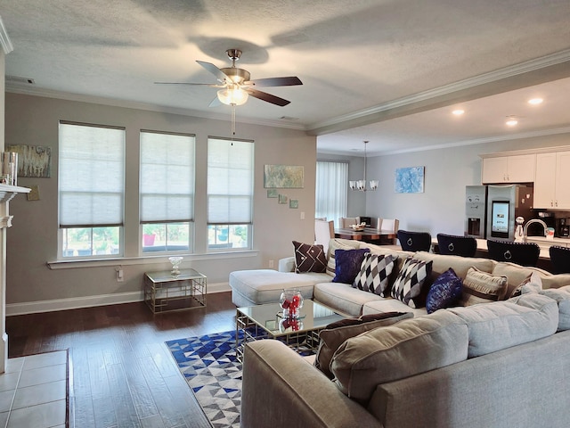 437 Arrowwood Dr, Grovetown, GA 30813 - living area with crown molding, dark wood-style floors, and ceiling fan with notable chandelier