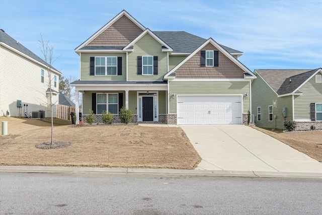 craftsman-style house with central AC unit and covered porch