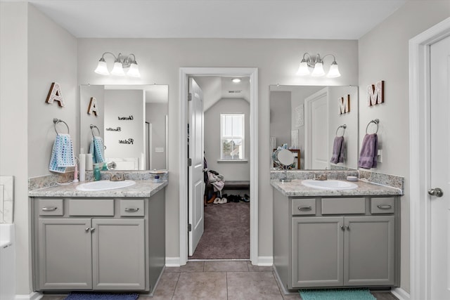 bathroom with vanity and tile patterned flooring