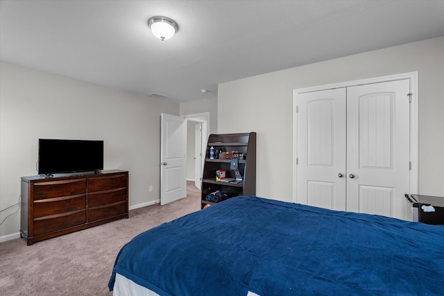 carpeted bedroom featuring a closet