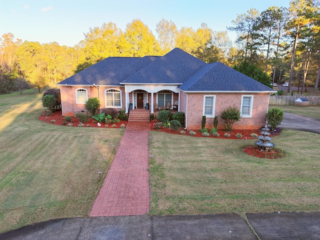 ranch-style house featuring a front yard and a porch