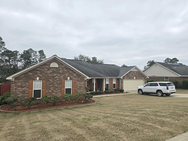 single story home featuring a front yard and a garage