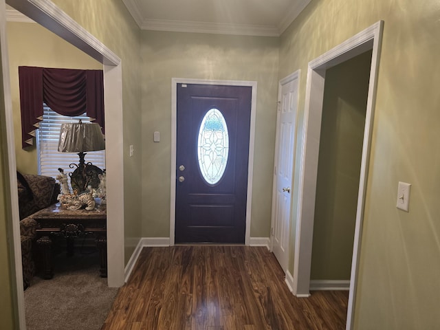 foyer with dark hardwood / wood-style floors and crown molding