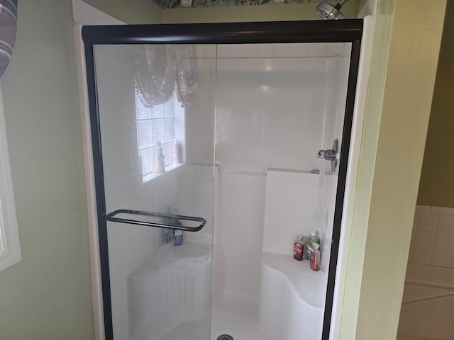 bathroom featuring an enclosed shower