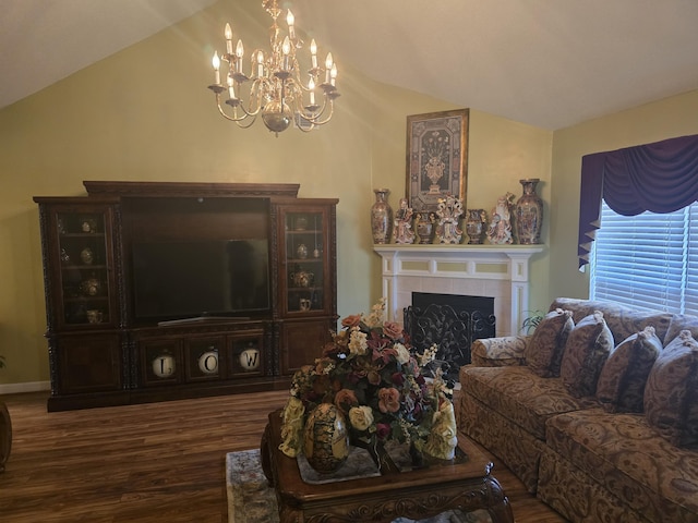 living room with a tile fireplace, dark hardwood / wood-style flooring, lofted ceiling, and an inviting chandelier