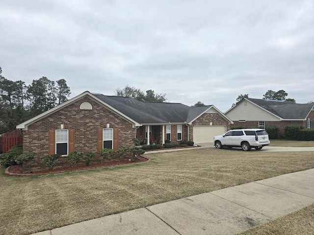 single story home with a garage and a front yard