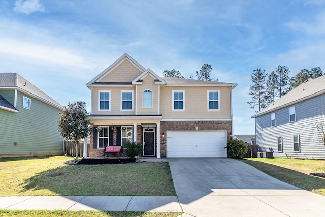 130 Clarinbridge Ln, Grovetown, GA 30813 - craftsman-style home featuring brick siding, a front lawn, a garage, and driveway