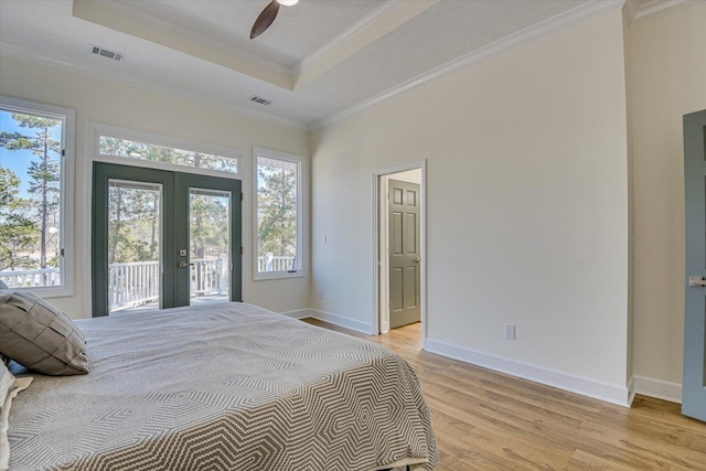 341 Crown Pt, Mccormick, SC 29835 - bedroom with french doors, access to exterior, light wood-type flooring, visible vents, and ornamental molding